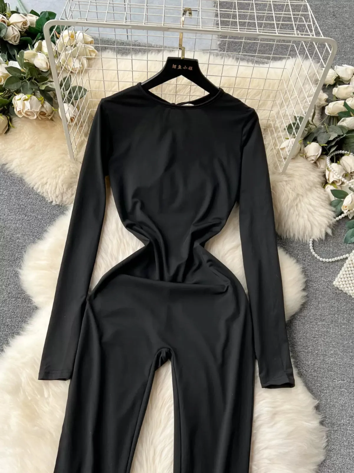 Avant-Garde Allure Sleek Black Bell-Bottom Jumpsuit