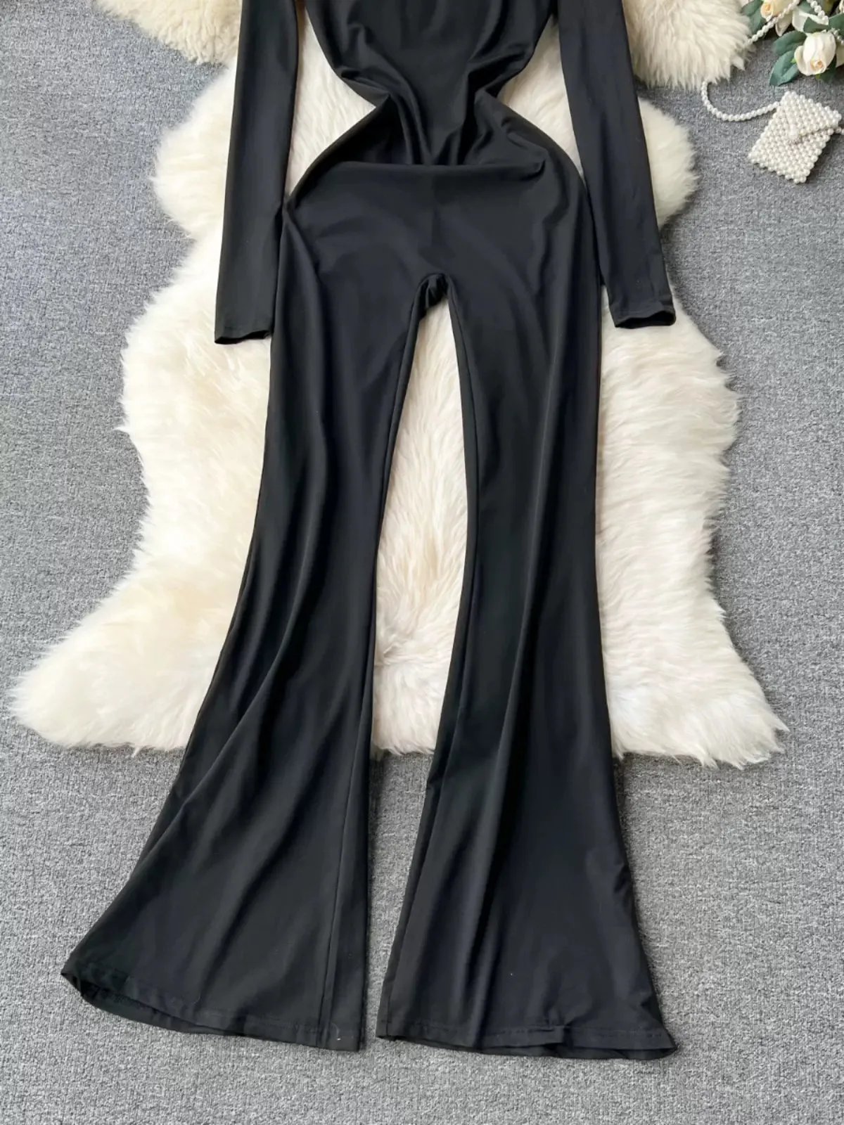 Avant-Garde Allure Sleek Black Bell-Bottom Jumpsuit